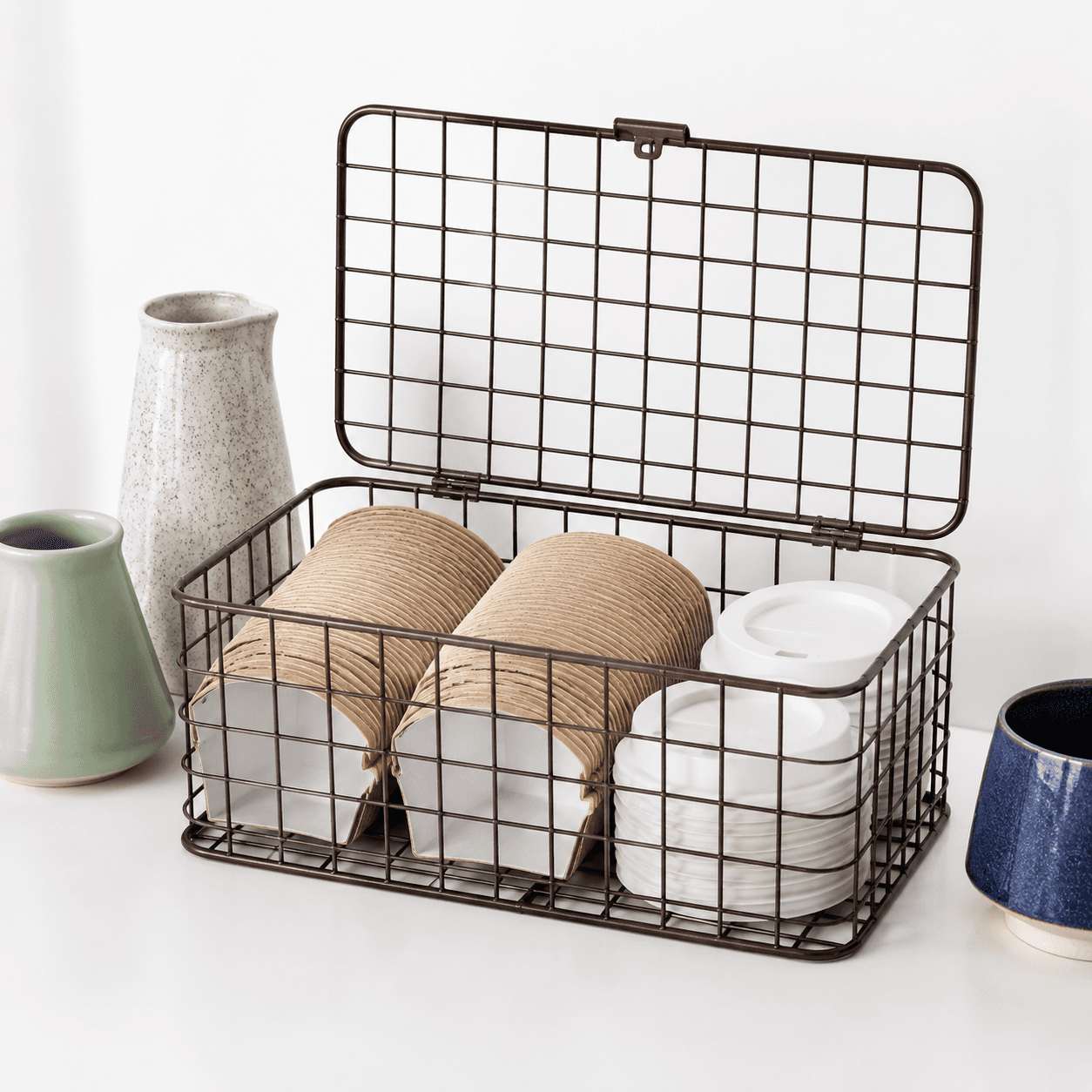 Cup Sleeve Basket — An open wire basket that keeps sleeves, lids and small extras to hand.