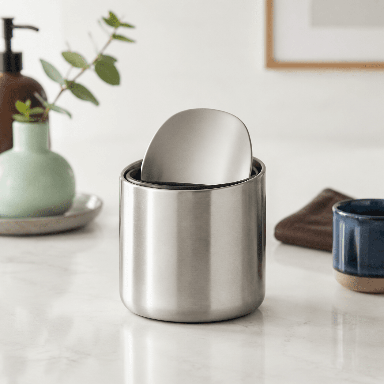 Mini Waste Cup — A small countertop bin for used stirrers, wrappers and sachets.