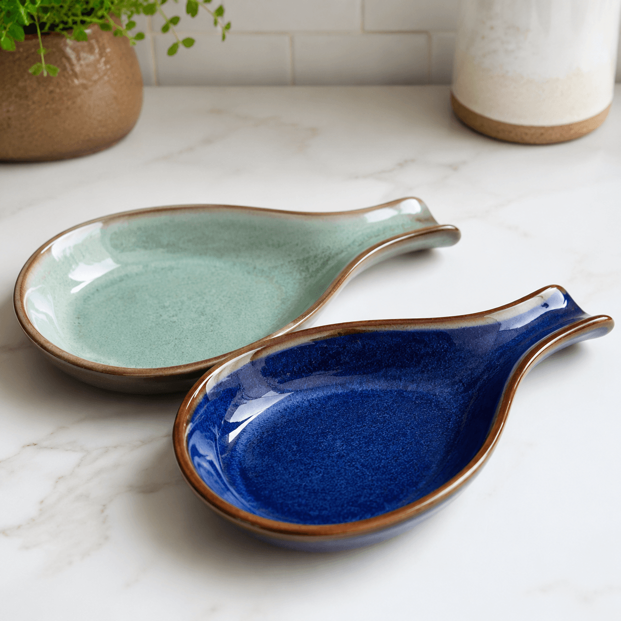 Spoon Rest Pair — Two ceramic rests that catch drips from stirring spoons and scoops.